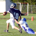 LESSON ON NEVER GIVING UP ON A PLAY â€” Fryeburg Academy quarterback Andrew Rascoe (#10) appeared to have a touchdown during the annual Pleasant Mountain Bowl, but he was hauled down from behind by Lake Regionâ€™s Kyle Stevens, who didnâ€™t give up on the play. Although Fryeburg Academy recovered the loose ball, Stevensâ€™ hustle and saving tackle proved to be a big one as the Laker defense held to keep the game close during last Fridayâ€™s season opener in Fryeburg. (Rivet Photos)