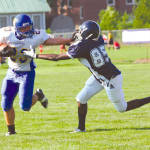 STIFF ARMED â€” Lake Region sophomore running back Cody Gibbons (#23) had a big day rushing the ball, picking up 123 yards. Here, Gibbons shakes a would-be tackle by Fryeburg Academyâ€™s Bright Amoako during Fridayâ€™s Pleasant Mountain Bowl. (Rivet Photo)