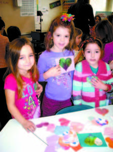 SONGO LOCKS SWEETHEARTS: From left to right, Jennessa Gaston, Ella Martin, and Haily were among the children who made and sold Valentines hearts for 10 cents each to raise $296 for Harvest Hills Animal Shelter. While doing the community service project, the kindergarten students — who attend Songo Locks Elementary School — engaged in arithmetic and writing plus got a daily dose of arts and crafts. (De Busk Photo)