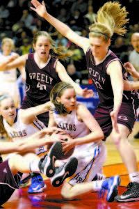 LOOKING FOR SOME HELP â€” Lake Region senior guard Sydney Hancock looks for some help after coming up with a loose ball. She is surrounded by Greely players Sarah Felkel (left) and Jaclyn Storey. (Rivet Photo)