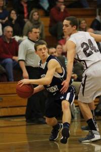 TYLER SAUNDERS (left) looks to pass while guarded tightly by a Ranger defender. (Rivet Photo)