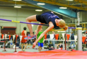OVER THE BAR â€” Fryeburg Academy senior Emily Heggie placed second in the high jump reaching 5-feet. Tia Jackson of Old Town won the event at 5-feet-2. (Rivet Photo)