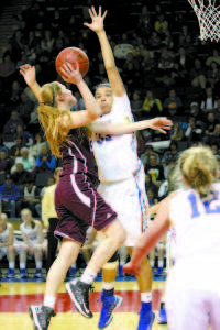 BLOCKED â€” Greely senior Jaclyn Storey has her shot blocked by Lake Region center Tiana-Jo Carter during Thursday's Class B West semifinal at the Cumberland County Civic Center. (Rivet Photo)