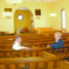 Rev. Franklin Anderson and Joanne Sullivan, of the United Parish UCC of Harrison and North Bridgton, sit inside the newly-repainted Harrison church sanctuary. (Geraghty Photo) 
