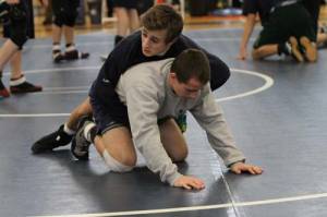 FAMILY AFFAIR — Connor and brother, Zach (bottom), go through a warm up prior to the Class B state finals at the Academy. (Rivet Photo)