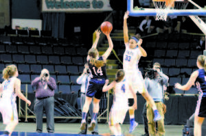 CLUTCH EFFORT ON THE BIGGEST STAGE â€” Presque Isle senior Chandler Guerrette had an incredible final, scoring 33 points, including this jump shot over Lake Region center Tiana-Jo Carter to lead the Wildcats to a comeback victory.
