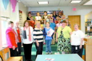 WINNING WRITER â€” Third grader Genevieve Goodspeed of Songo Locks School is pictured with SLS staff and fellow students. Pictured are Sis Littlefield, MaryJane McLoon, Bunny Greenlaw, Laurel Cebra, Kimberly Nielsen, Marion Merrill, as well as students: (second row) Isabel Adkins, Hannah Fitzpatrick, Bryce Anderson, Rebecca Caron, Emeline Akeley; (third row)  Preston Frye, Salem Gerrish, Connor Cribby, Brody Sandberg; (fourth row) Abigail Elsaesser, Kelsey Gerry, Martin Shimko, Gavin Thayer, Kayt Hall and Emma Fogg. 
