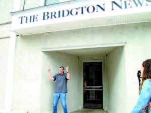 A BIG THUMB'S UP â€” When the New York Times came to Bridgton to interview Stephen King, he told the editors specifically to use The Bridgton News as backdrop. Here, after a long day of interviewing with both the Times (at Rosie's in Lovell) and CBS This Morning (inside the Bridgton Library), King still had energy enough to give thumbs up to the newspaper serving Bridgton â€” a town he calls the perfect example of "little America." Bridgton is the real-life inspiration for his 2009 epic novel, Under the Dome, to be aired by CBS starting June 24 as a 13-episode TV series. 