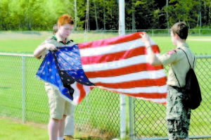 Local scouts raised the American flag at the new complex.