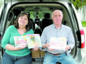 PAM AND BILL BRUCKER â€” drove to Saco to buy 500 children's books to give away this summer. Since the Bruckers retired to Bridgton, their passion for teaching and giving back to their adopted community has only gained in strength.   (Photo by George Bradt)  