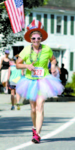 EYE CATCHER — Marsha Wood of Harrison caught the attention of spectators as she jogged by on her way to the finish line.