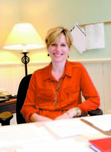 NEW HEADMASTER Erin Mayo settles into her office at Fryeburg Academy. (Photo by Rachel Damon/FA)