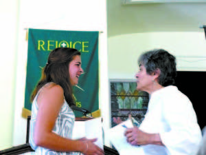 SASHA AZEL, a recent graduate of Fryeburg Academy, won the Kezar Lake Watershed Associationâ€™s Joan Irish Award this year. She is pictured here receiving the award from Sue Lanser of the Kezar Lake Watershed Association.    