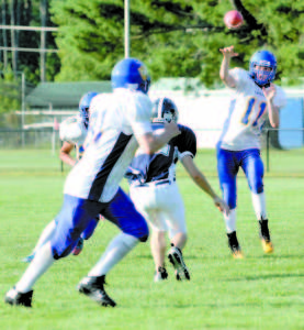 QB Quinn Piland looks to flip a quick pass to tight end Nick Hall during Lake Region's exhibition game last Friday at Fryeburg Academy, a 36-14 loss. The Lakers travel to Poland this Friday night. (Rivet Photo)