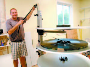 LAST SUMMER FOR FILM â€” Bridgton Twin Drive-In owner John Tevanian holds film for two movies, Planes and Ironman 3, resting on a platter Friday, ready to be wound into a projector for the weekend showing. When he acquired the three-tray platter system last year, it didnâ€™t cost him a dime, because 35-millimeter film is being discontinued by the movie industry in favor of digital projection systems. Although film prints of first-run movies were in short supply this summer, â€œWe had no problem playing all the first-run movies we wanted to play this summer,â€ Tevanian said. Heâ€™s also confident film will be around next year, but he has seen the handwriting on the wall, and will be converting to digital.  (Geraghty Photo)    