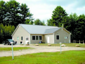 ALL IN â€” Bridgton Twin Drive-In owner John Tevanian spared no expense in replacing his worn-out concession stand with this new building, completed this summer. At roughly triple the size, with a takeout window and projection room in front, the year round building cost Tevanian around $350,000, and was built to specs to accommodate a digital projector, which requires special glass, more vents, stronger air-conditioning and an Internet connection. With two digital projectors at around $70,000 each, Tevanianâ€™s total investment adds up to around $500,000. With digital film an inevitability, he said, â€œI decided I was either all in, or all out.â€ (Geraghty Photo)     