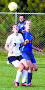 WAITING FOR THE BALL TO COME DOWN are Fryeburg Academy's Mackenzie Buzzell (left) and Lake Region's Meghan Boos. (Rivet Photos)