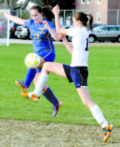 HIGH FLYING ACTION at the Lake Region vs. Fryeburg Academy girls' varsity soccer game. Pictured are (left) Melody Millett of Lake Region and Lexi L'Heureux-Carland of Fryeburg.