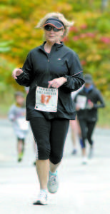 ANOTHER OFF THE LIST â€” Linda Elton of Whitehouse, Ohio and her husband, Arnie, plan to take part in a race in each U.S. state as part of their "bucket list." Scratch Maine off the list after the couple completed the Waterford Fall Foliage 5K. (Rivet Photos)