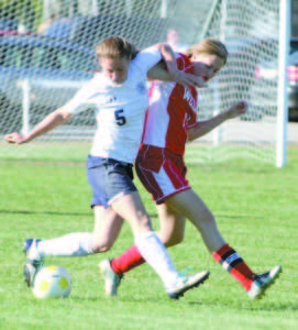 JULIA QUINN (left) looks to control the ball against Wells.
