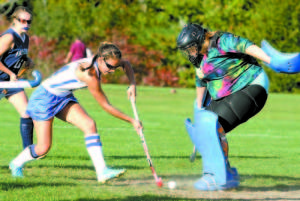 SHOT...SAVE â€” Lake Region's Lucy Fowler fires a point blank shot at Fryeburg Academy goalie Jasmine Ramsay, who kicked it away. Fowler, however, scored twice in the second half to lead Lake Region to a 2-1 victory. (Rivet Photos)