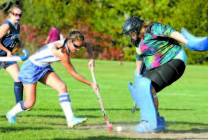 SHOT...SAVE — Lake Region's Lucy Fowler fires a point blank shot at Fryeburg Academy goalie Jasmine Ramsay, who kicked it away. Fowler, however, scored twice in the second half to lead Lake Region to a 2-1 victory. (Rivet Photos)