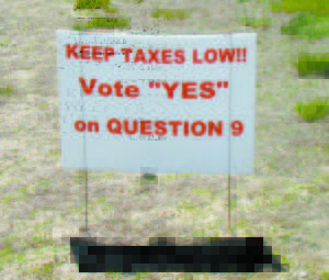 HOT BUTTON ISSUES â€” Passions are running high over the two citizen-petition initiated referendum questions up for a secret ballot vote in Bridgton next Tuesday, June 10, judging by these professionally-printed signs. Backers of Question 9 want to put off paying for Phase 1 repairs to Town Hall, but others feel just as strongly that the repairs should go forward as Bridgton Selectmen have planned. Backers of Question 10 want to send a clear message that a proposed cell phone tower is not welcomed on Hio Ridge Road. Of the eight other referendum questions, three deal with ordinances that themselves are not without controversy: a Local Preference Housing Ordinance, a Fire Protection Ordinance and a Sign Ordinance. 