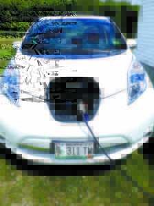 A 2014 NISSAN LEAF â€” a 100% electric car, is plugged in and charging behind the Casco Town Office on Thursday. The town leased the demonstration vehicle from the Greater Portland Council of Governments.  (De Busk Photo)