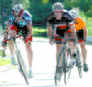 FINAL BIG PUSH â€” Jeff Hershberger (right) and other racers give it their all as they approach the finish line at last Saturday's Tour de Lovell.