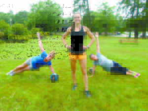 Owner of Sunrise Fitness Personal Training, Amy Young (center) encourages Katherine Riggs (left), of Naples, and Jennifer Hall-Lewis, of Casco, during a boot camp fitness session on the Naples Village Green recently. (De Busk Photo) 