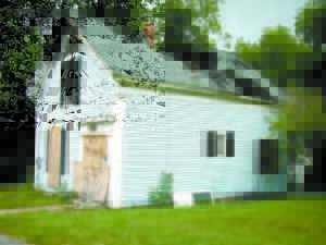 IT COULD COLLAPSE â€” Bridgton Code Enforcement Officer Robbie Baker told Bridgton Selectmen this home on Cottage Street could collapse this winter from snow loads if it isnâ€™t torn down. Selectmen agreed, empowering Baker to notify the owners that the building must be removed. (Geraghty Photo) 