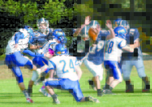 OFF THE EDGE â€” Twice, Fryeburg's Ryan Gullikson blocked extra-point attempts by Falmouth. 