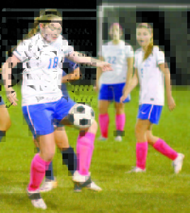 MAKING A STOP â€” Lake Region defender Grace Farrington makes a stop during last Saturday's night game against Fryeburg Academy. (Rivet Photo)