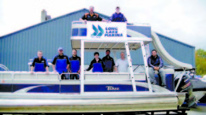 THE CREW FROM Long Lake Marina poses aboard â€œthe fun boat.â€ Long Lake Marina recently acquired property in Bridgton with ample boat storage space, a maintenance shop plus a show room. Last fall, when the marinaâ€™s Naples-based boat storage facility reached its capacity, owner Jim Davenport knew it was time to expand the business again.   (De Busk Photo)