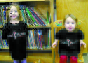 TWINS ISABELLA (LEFT) AND JULIA DOYON enjoy some free time at the Raymond Village Library on Tuesday afternoon. The girls, who turn four years old in November, were diagnosed with Hypophosphatasia (HPP) earlier this summer. (De Busk Photo)  â€œThe truth is we do not know everything there is to know about HPP. Itâ€™s an area where we still have much to learn. However, by coming together, sharing experiences, supporting research, and writing our efforts, we can make a difference and move closer toward a treatment.â€ â€” Deborah Sittig, Founder, Soft Bones Oct. 27 through Oct. 31 is Hypophosphatasia (HPP) Awareness Week.  Hypophosphatasia, which is pronounced high-poe-fos-fuh-TAY-shuh, is a rare inherited bone disease. The symptoms and time of onset varies greatly from patient to patient. HPP affects the way the body absorbs minerals such as calcium and phosphorous. Therefore, HPP patients experience problems stemming from â€˜softâ€™ bones and teeth. Symptoms range from bone or joint pain to broken bones. HPP can cause health issues with the kidneys, muscles and the brain.  For more information, check out softbones.org  