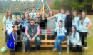 BUDDY BENCHES ADDED TO PLAYGROUNDS at Naples and Sebago schools, donated by Teens Without Borders, a service academy at Lake Region High School. Pictured are: back row left to right, Devin Langadas, Mary Loan, Sophia Fagone, Sarah Hancock, Mike Rust, Arianna Libby, Lauren Williams, Allison Morse, Kyle DeSouza, Emily Secord, Abby Scott-Mitchell, Grace Farrington; front row, Devynn Turner, LRHS teacher Ian Carlson, LRHS teacher Christina Gaumont and Michaela Tripp. 