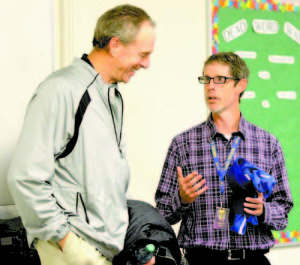 THIS LAKER GEAR former Boston Celtic Dave Cowens might actually wear. Cowens was presented a Lake Region shirt by Athletic Director Paul True. (Rivet Photo)