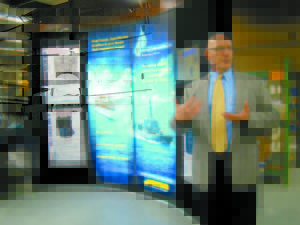 PROUD TO BE THERE — Howell’s Vice President of Product Development, Engineering Group John Bliss explains the many types of fluid treatment technologies and commercial marine products the company supplies to the maritime industry, particularly the U.S. Navy. (Geraghty Photo)