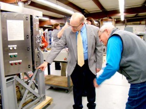 THE LATEST TECHNOLOGY — John Bliss, vice president of product development at Howell Labs, explains the workings behind one of the company’s seawater chlorinator machines. Howell products, also including dehydrators and humidity measuring equipment, can be found on virtually every class of blue water surface ships and submarines in both the Navy and Army. (Geraghty Photo)