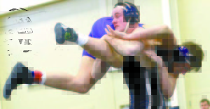 KYLE BENNETT lifts his opponent into the air during Saturday's Invitational held at Fryeburg Academy. (Rivet Photo)