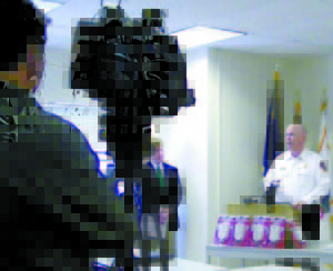 ENCIRCLED BY CARBON MONOXIDE DETECTORS, Casco Fire Chief Jason Moen finishes talking at the Carbon Monoxide Community Awareness and Education Press Conference, which took place Thursday morning. (De Busk Photo) 