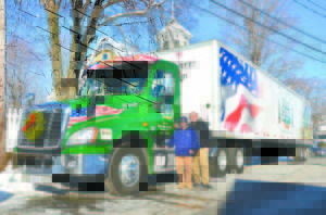POLAND SPRING TANKER DRIVER SCOTT EDWARDS will be accompanied by his 11-year-old son, Colin, when he drives in the Wreaths Across America caravan to Arlington National Cemetery. (Photos by Amanda Walker)