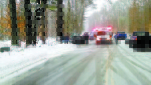 AT THE SCENE â€” Police and rescue members respond to the one-vehicle accident on Route 5 Tuesday, which claimed the life of a Brownfield woman, who was the passenger inside the pick-up truck that struck a tree. (Photos courtesy of the Fryeburg Police Department)