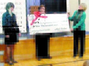 HOUR OF CODE check presentation last Thursday included Stevens Brook Elementary School Principal Cheryl Turpin (left), Laura Gurley-Mozie, Tech Integration Specialist and Hour of Code organizer (middle) and State Representative Phyllis Ginsler.