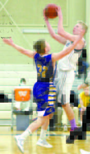 Ryan Gullikson of Fryeburg Academy takes the ball strong to the hoop against Falmouth. (Rivet Photo)
