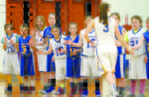 PRESENT MEETS THE FUTURE â€” Lake Region rec players greeted Laker starters, including CeCe  Hancock, prior to Monday's game against Kennebunk. (Rivet Photo)