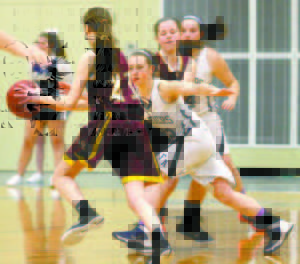 JULIA QUINN played tight defense against the Capers and netted 13 points for the Raiders. (Rivet Photo)