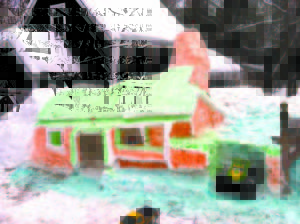 LIKE A CAKE with green and orange frosting, a lighthouse emerged from a snow bank at the Fosterville Road home of Richard Lee.   