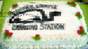 NOW, IT WILL BE AS EASY as pie for people driving electric cars to recharge their batteries in the Casco Village. This cake was the centerpiece at the refreshment table following a ribbon-cutting ceremony for the electric car charger. (De Busk Photo) 