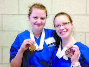 LRVC SKILLSUSA COMPETITORS in Health Occupations show off the medals they recently won at the Maine SkillsUSA Conference held in Bangor last week. Bailey McDaniel (left) brought home the Gold Medal in Basic Health Care and Monica Martin won a Bronze Medal in the Nurse Assisting Competition (right).